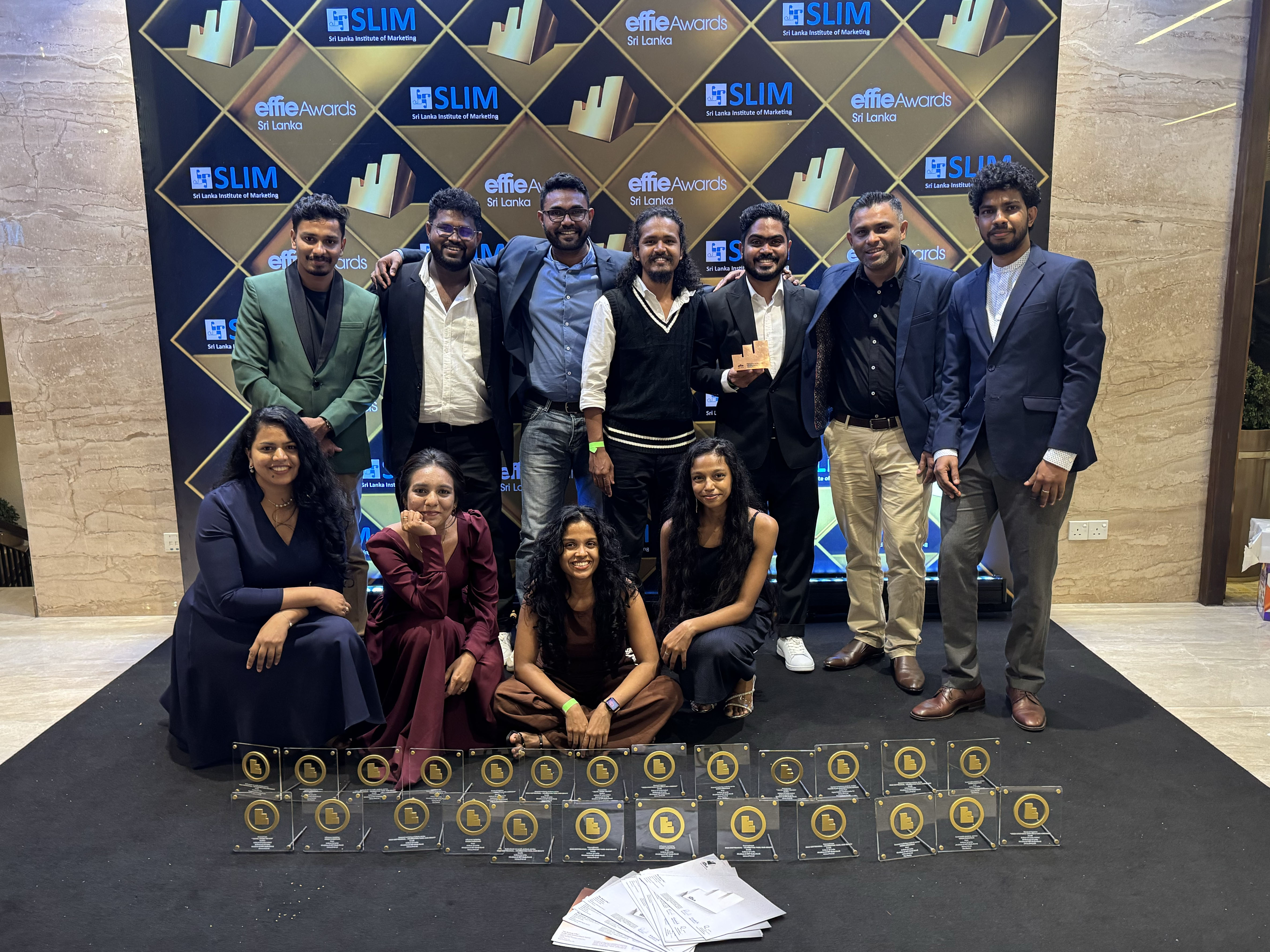 Litmus team at Effie Awards with trophies